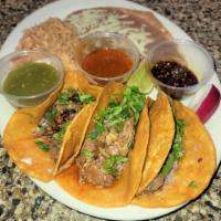 Birria Tacos Platter · 3 Birria Tacos with Rice and Beans.
Garnished with Cilantro & Onions. Green Salsa & Birria C...