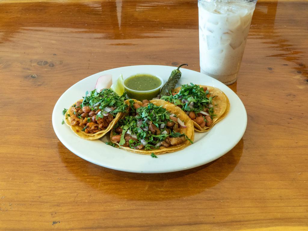 Tacos Al Pastor Platter · 3 delicious tacos al pastor cooked in our ingredients to perfection. Topped with onions, cilantro, grilled onions, jalapeño and green salsa on the side.