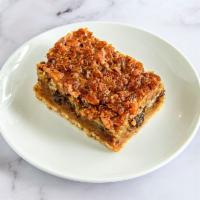 Bourbon Chocolate Pecan Bar · Our delicious take on an old favorite! Pecans, chocolate chips, and a hint of bourbon on top...