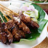 Beef Satay · 4 pieces. Grilled beef marinated with satay sauce on skewer served with peanut sauce.
