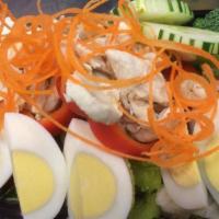 Montien Salad  · Steamed chicken, boiled egg wedge with red and green pepper, carrot, tomato, red onion, cucu...