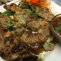BBQ Pork · Grilled and marinated Thai-style BBQ pork on a skewer.