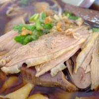 Duck Noodle Soup · Flat noodle soup with roasted duck, bean sprout, garlic, scallion and cilantro in dark soy s...