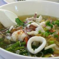 Seafood Noodle Soup · Rice noodle soup with seafood, bean sprout, garlic, scallion and cilantro.