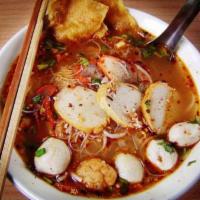 Tom-Yum-Moo-Sub Noodle Soup · Spicy rice noodle soup with ground pork, fish ball, bean sprout, grounded peanut, garlic, sc...
