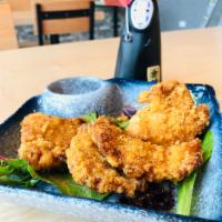 Karaage Chicken(5pcs) · Juicy fried chicken thigh with an original garlic pepper served with Tanaka's original chili...