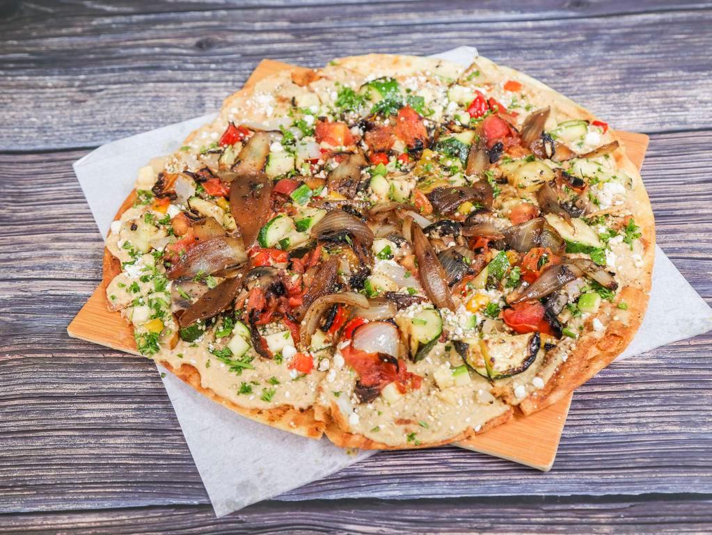 Veggie Flatbread Pizza · Hummus, quinoa, parsley, roasted vegetables, roasted tomatoes, scallions and feta cheese.