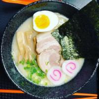 Tonkotsu Ramen · Ramen noodles, pork charsu, naruto (fish cake), soft boil egg, mushrooms, green onion and dr...