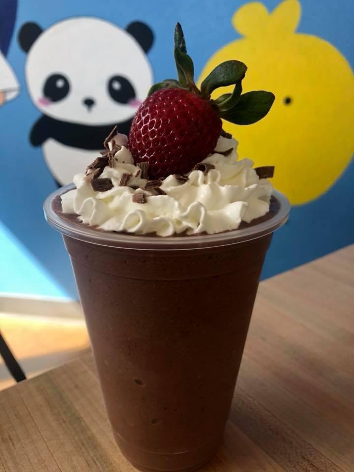 Choco Berry · Chocolate and strawberry smoothie topped with whipped cream, chocolate shavings, and a strawberry.