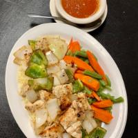Chicken Kabob · Served over rice with sauce and includes a choice of a cup of soup, salad or coleslaw.