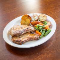 Pork Chops · 2 center cut pork chops. Dinner includes: potato , vegetable and a choice of soup, salad or ...
