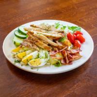 Cobb Salad · Grilled chicken, egg, blue cheese, bacon, tomato and cucumber.