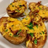 Potato Skins · Served with bacon and cheddar cheese.