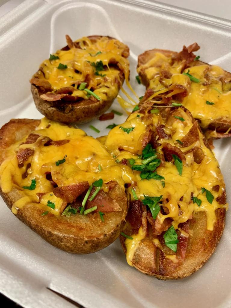 Potato Skins · Served with bacon and cheddar cheese.