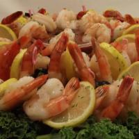 Shrimp Cocktail · Four per order. Extra large jumbo shrimp served icy cold with fresh-cut lemon wedge and zest...