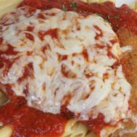 Veal Cutlet Parmigiana · Tender veal cutlet topped with our tomato meat sauce and a select blend of cheeses.