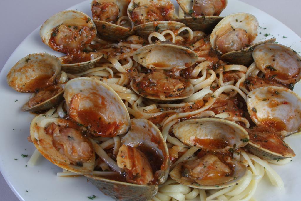 Clams ala Zuppa · Our fresh locally sourced little necks steamed in our own spicy red or white clam sauce. Served over your choice of pasta.
