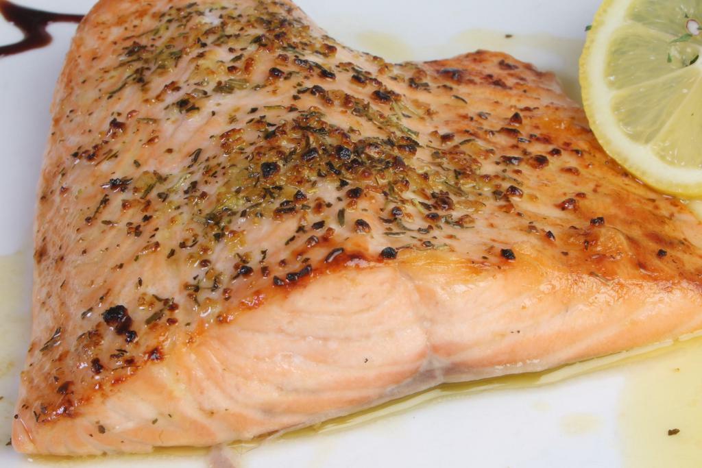 Key West Salmon · Fresh filet of salmon rubbed with lemon, basil and thyme key West spices and then broiled to perfection.