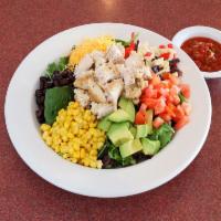 Santa Fe Chicken Salad · Fresh mixed greens topped with grilled chicken breast strips, avocado, corn, black beans, to...