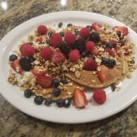 Mixed Berry Pancakes · Stone ground whole wheat pancakes topped with low-fat yogurt, granola, fresh strawberries an...