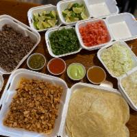 2lb Family Pack · 30 tortillas of choice, choice of up to 2 protein, 4 cold toppings, 4 salsa selection and li...