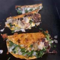 Quesataco · Corn Tortilla Quesataco filled with cheese, protein of choice, onion, cilantro and salsa of ...