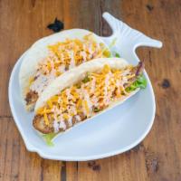 Russ' Taco · 2 Larger flour tortillas with lettuce, tomato, cheese, and our homemade taco sauce with 1 si...