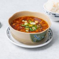 Hot and Sour Soup · Spicy hot and sour soup with tofu, egg, and mixed vegetables.
