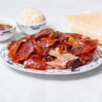 Peking Duck (half duck) · Roasted duck, peeled and then served with 6 pancakes.