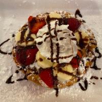 FUNNEL CAKE WITH FRUITS · With Powder Sugar, Bananas, Strawberries, Wipcream and Chocolate or Lecherita
