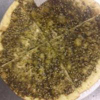 Zaatar Pie · Thyme, oregano, sesame seeds and olive oil.