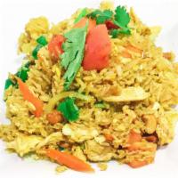 Pineapple Fried Rice · Fried rice with egg, pineapple, curry powder, cashews nut, carrot, tomato, onion and scallio...