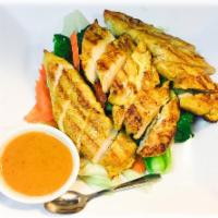 Pra Ram · Steamed mixed veggies and grilled chicken. Served with peanut sauce and rice. Served with ja...