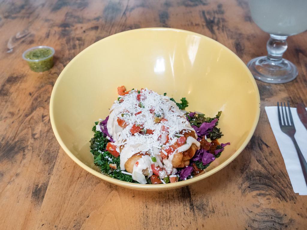 Grilled Chicken Bowl · Grilled chicken breast, sauteed kale, black beans, rice, cabbage slaw, avocado verde, pico de gallo, and cotija cheese.