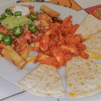 Canasta Platter · Made with a combination of taquitos. Quesadillas, chicken wings and crispy nachos.