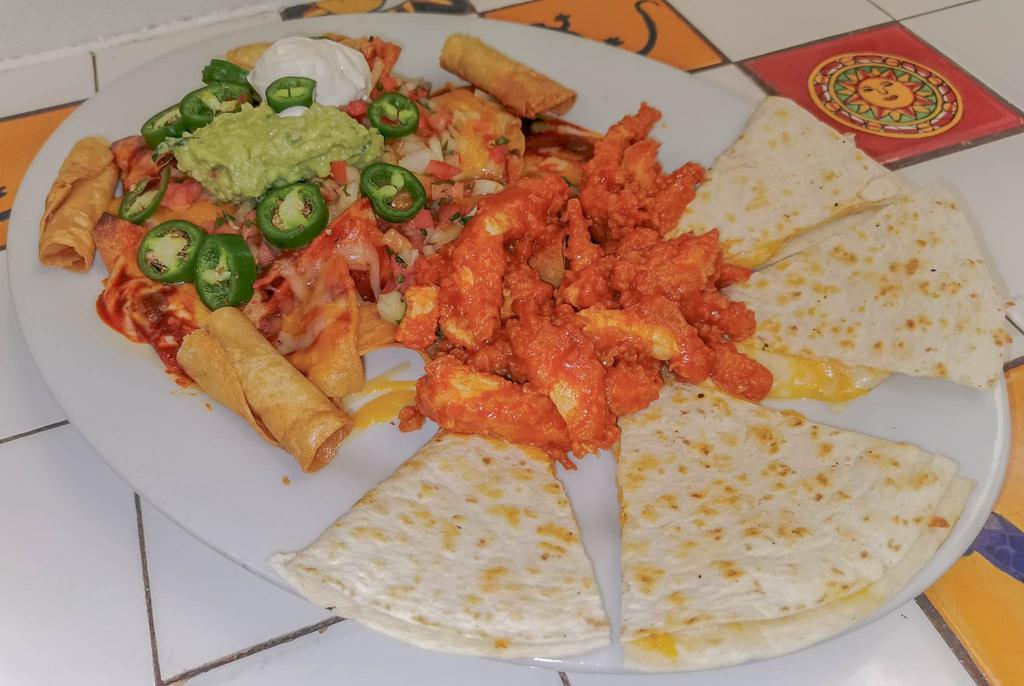 Canasta Platter · Made with a combination of taquitos. Quesadillas, chicken wings and crispy nachos.
