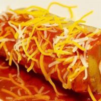 Tamales · 2 chicken tamales covered with red sauce and cheese.  NOTE: Plate comes with rice, beans, sa...