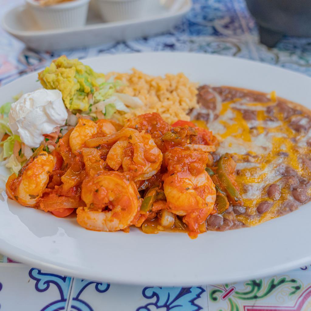 Camarones Rancheros · Shrimp sauteed with peppers, onions and cooked in our own sauce.           NOTE: Plate comes with rice, beans, salad, sour cream and guacamole