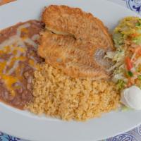 Filete a la Plancha · Fish tilapia filet grilled.      NOTE: Plate comes with rice, beans, salad, sour cream and g...