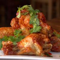 Curry Wings · Wings tossed in the same creamy curry with hints of lemongrass and Thai spices.