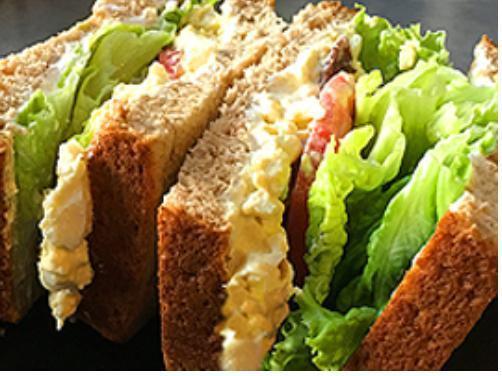 Sacks Dali Sandwich · Homemade egg salad, country bacon, leaf lettuce, tomato, cream cheese, mayo, on 12 grain bread.