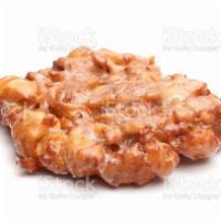 Apple Fritter · Apple Fritters are luscious deep fried donuts filled with apples, cinnamon and drizzled with...