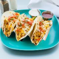 Breakfast Tacos · 3 corn tortillas filled with scrambled eggs topped with jack cheese, salsa, sour cream and a...