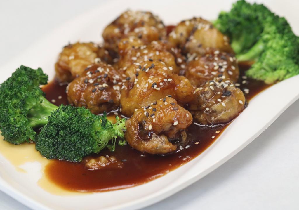 Sesame Chicken · Soy protein, fried mushroom, broccoli, and sesame seeds.