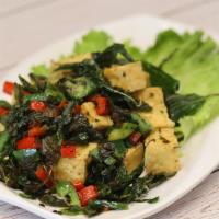 Salt and Pepper Tofu · Deep-fried tofu, bell pepper, jalapeno, and basil garnish with lettuce. Vegan. Gluten-free.