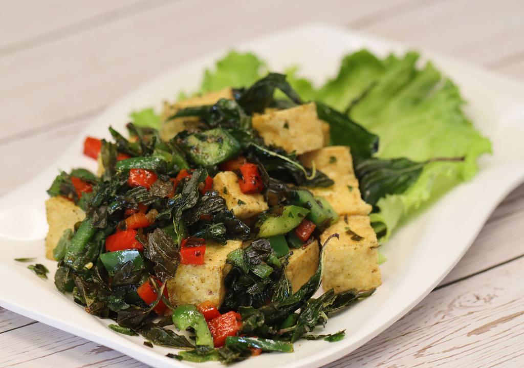 Salt and Pepper Tofu · Deep-fried tofu, bell pepper, jalapeno, and basil garnish with lettuce. Vegan. Gluten-free.