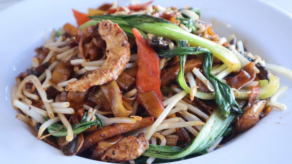 Stir Fried Flat Noodle · Flat rice noodle, bean sprout, soy-ham, soy-shrimp, carrot, bok choy, and mushrooms. Vegan.