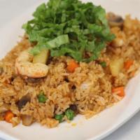 Tom Yam Fried Rice · Fried rice, mushroom, green bean, carrot, corn, soy shrimp, and tom yam paste. Vegan. Gluten...