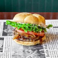 Onion Burger · 1/4 lb. Char broiled fresh ground chuck patty, Wibbley's dressing, grilled onions, lettuce, ...