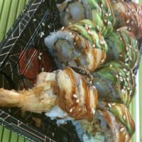  Black Dragon roll  · Tempura shrimp, cream cheese, cucumber inside, topped with BBQ eel , avocado ,eel sauce
,ses...